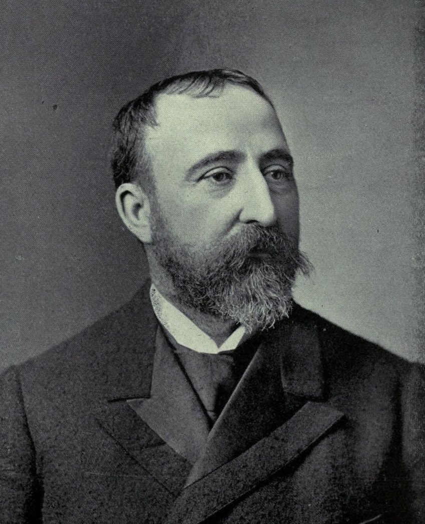 Black-and-white engraved portrait of a man with a full beard, dark suit and white collar, looking to the right